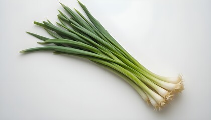 A bunch of scallions on a white background.