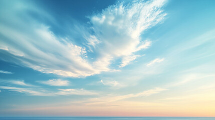Obraz premium A serene summer sky featuring a gradient of soft blue and white hues, capturing the peaceful beauty of a bright, airy day on the horizon