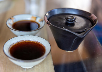 bowls and black tea in chinese tea ceremony
