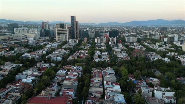 Aerial dolly shot of Mexico City towers and upscale shopping district called Polanco.