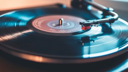 Obraz premium A close-up of a vintage vinyl record player with a spinning record, showcasing the intricate needle and turntable in warm, ambient lighting.