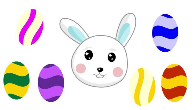 Animated video of an easter bunny head with several colorful eggs on a white background, art, cartoon, chocolate.