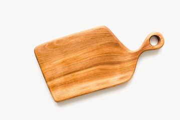 Kitchen board made of wood on a white background. Kitchen board made of walnut wood.