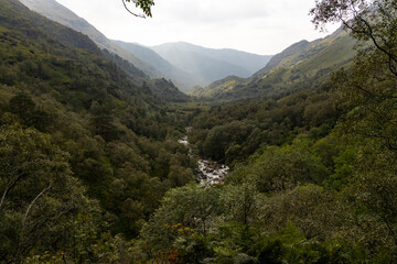 Steall Waterfall, a breathtaking natural wonder in the Scottish Highlands, from rugged cliffs into...