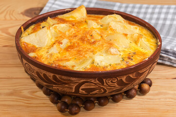 Potato casserole with melted cheese crust on top, front view