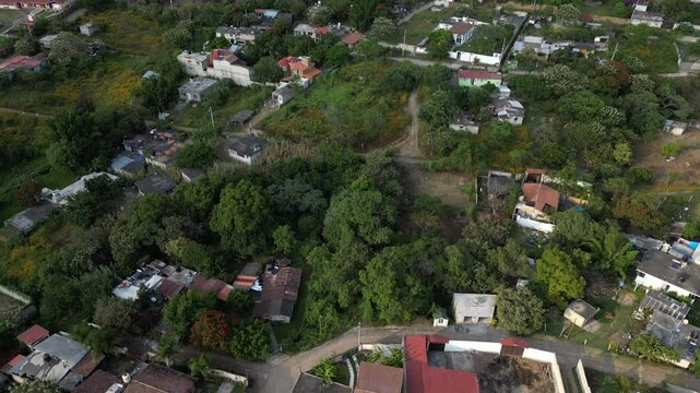 Flying low over scattered homes and dwellings in rural village of Malinalco, Mexico.
