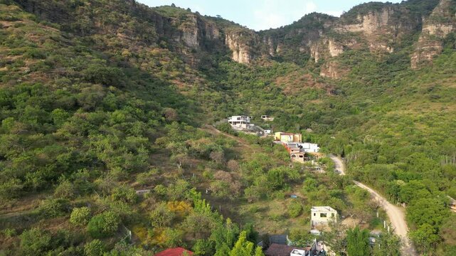 Dirt road and homes at the edge of mountain village called Malinalco. Mexico.
