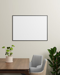 A black horizontal photo frame mounted on a beige wall, positioned above a table with plants and modern chairs, ideal for horizontal image presentations.
