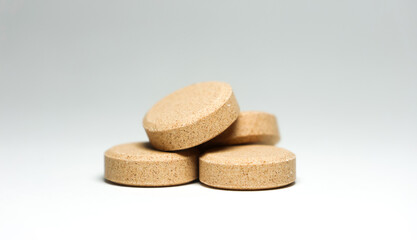 Brown pills isolated on a white background