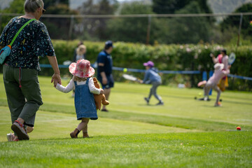 children play grass tennis in a lawn tennis court learning and having fun