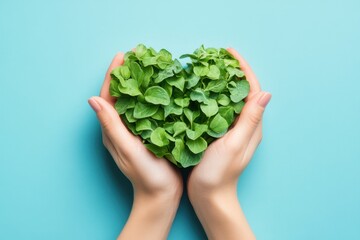 A pair of hands gently cupping lush green leaves shaped as a heart symbolizing care. Generated AI