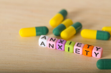 Mental Health and Medication: Anxiety Word Formed with Letter Beads and Capsules