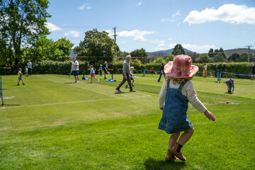 children play grass tennis in a lawn tennis court learning and having fun