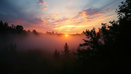 Fototapeta premium Vibrant interplay of sunrise natural elements and mist creates a harmonious blend of colors and text