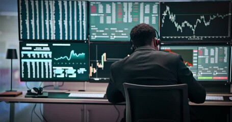 Man, back and screen with graph for stock market research, investment or monitoring NFT at office. Male person, broker or financial advisor with chart or display for trading advice at call center - Powered by Adobe