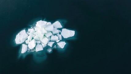 A cluster of small sea ice pieces floating together in the Arctic Ocean, fragments, cluster