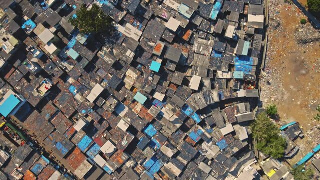 Aerial view of slums in Mumbai, Maharashtra. Drone flying over a Backward or underdeveloped area in Mumbai city. Living in India. 