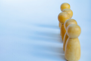 A wooden figure looking at the direction. Representing satisfaction or happy with something