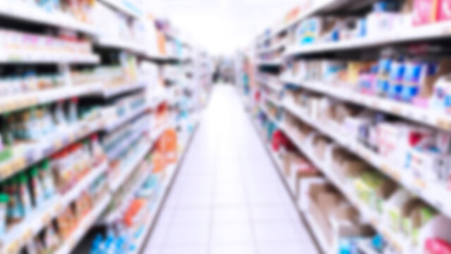 Blur supermarket chain background. Retail industry. Rack system. Shopping. Aisle. Grocery store. Defocuced shelves with products, food. Cpg. Super mart. Inflation concept. Discount. Consumer goods.