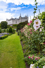 Dunrobin Castle, fairy-tale gem overlooking North Sea, offers breathtaking gardens, exquisite summer blooms. A masterpiece of elegance, lush landscapes meet historic charm, unfold on manicured lawns
