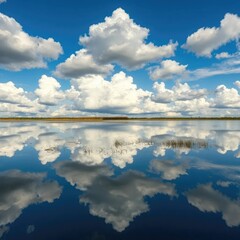 Obraz premium Clouds reflected in the still waters of a pond, pond, sky, water