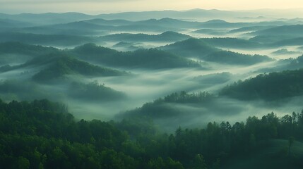 Misty mountain landscape at sunrise.