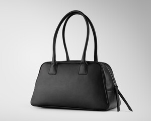 Naklejka premium Elegant and fashion black leather handbag on a white background