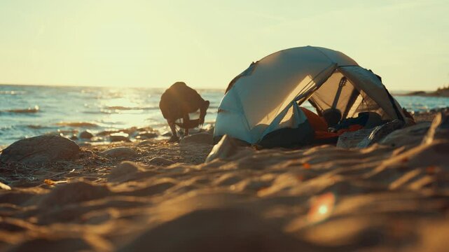 Lonely traveler on sea beach, sitting in chair near tent, solitude in nature. Local tourism and backpacking, unity of person and nature, man relaxing and admiring sea view, camping on ocean coastline