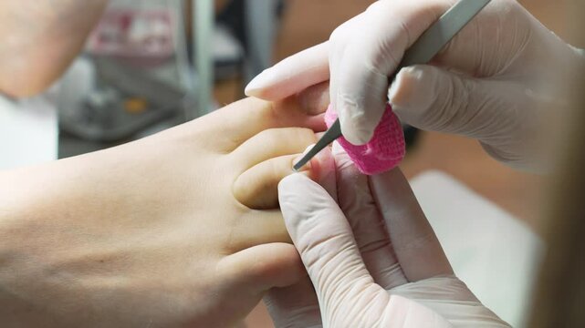 Professional podiatrist or chiropodist working. Foot and toenails beauty and hygienic treatments. 