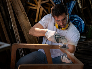 Skilled carpenter working on a woodworking project in his workshop