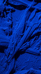 Lumpy texture of a blue paint colour