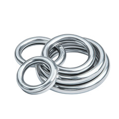 Fototapeta premium Metallic Rings: A collection of polished, silvery metal rings, intricately arranged, capturing the allure of industrial design and minimalist aesthetics, perfect for visual concepts.