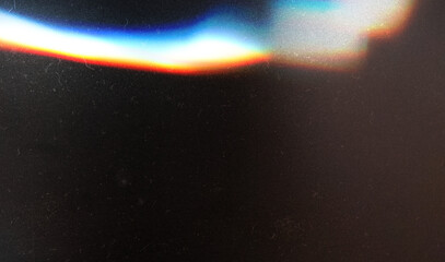 Grunge abstract background. Damaged screen. Orange glitch noise on blue scratched texture with dust.