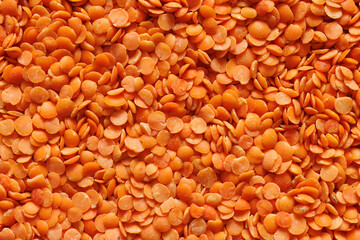 Red lentils, close-up, macro view. Red lentil background