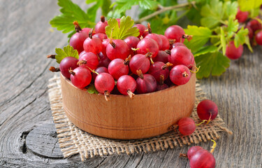 Ripe red gooseberries in bowl