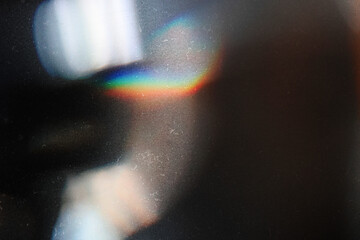 Designed film texture background with heavy grain, dust and a light leak Real Lens Flare Shot in...