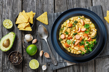 white bean chickpea chili with sausages, zucchini