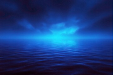 Obraz premium Blue ocean under night sky with glowing light.