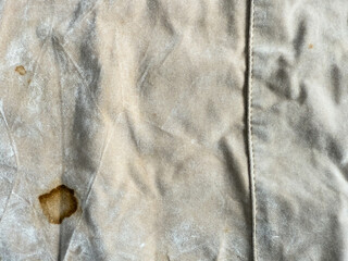Stained fabric. Stained white cotton fabric