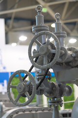 Detailed view of industrial valves and controls in a manufacturing facility