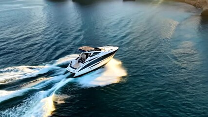 High-Speed Motorboat Sailing Across the Ocean with Stunning Coastal Views