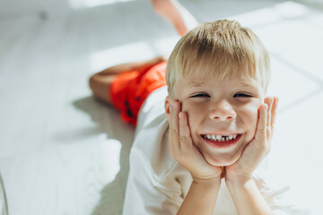 Beautiful little boy without a tooth. The child lost a tooth.