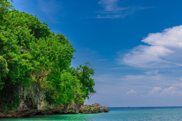 Magnificent view of the Balinese Padang Padang Beach on the island of Gods with turquoise blue waters great for surfing the waves colourful skies on the island of Bali Indonesia 