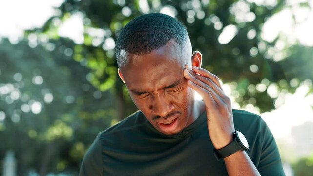 Man, headache or fitness with pain for stress, strain or intense ache at outdoor park. Male person, migraine or accident with vertigo or dizziness from overworked workout, heat or exercise in forest