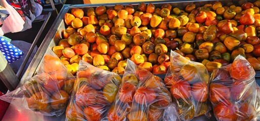 Mamoncillo fruit for sale. Caribbean street vendor.