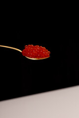 spoon with red caviar macro photo