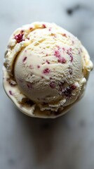 Creamy vanilla ice cream scoop with raspberry swirls delightful dessert close up shot summer treat
