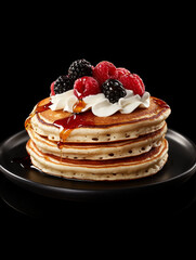 Berry-topped pancakes with syrup, a delicious breakfast stack