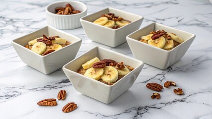Delicious banana and pecan breakfast bowls, perfectly portioned for a quick and healthy start to your day. Enjoy the sweet and nutty flavors.