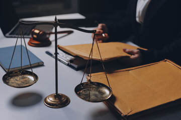Judge gavel with Justice lawyers having team meeting at law firm background. Concepts of Law and...